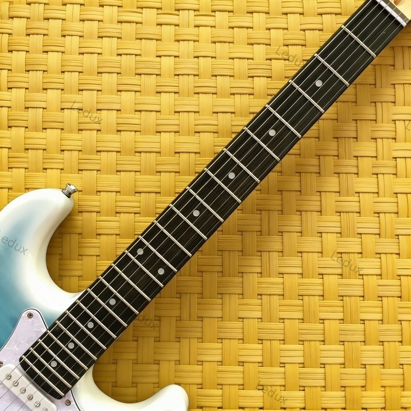 blue quilted electric guitar maple top tremolo bridge rosewood fretboard