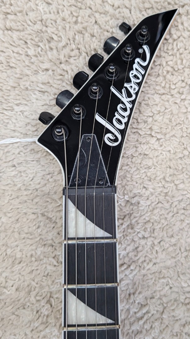 Jackson Model JS32T Rhoads White w/black 24 Fret String Thru Electric Guitar
