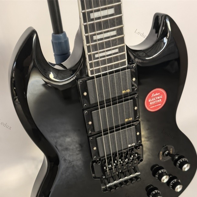 electric guitar black tremolo bridge HHH pickups rosewood fretboard lock nut