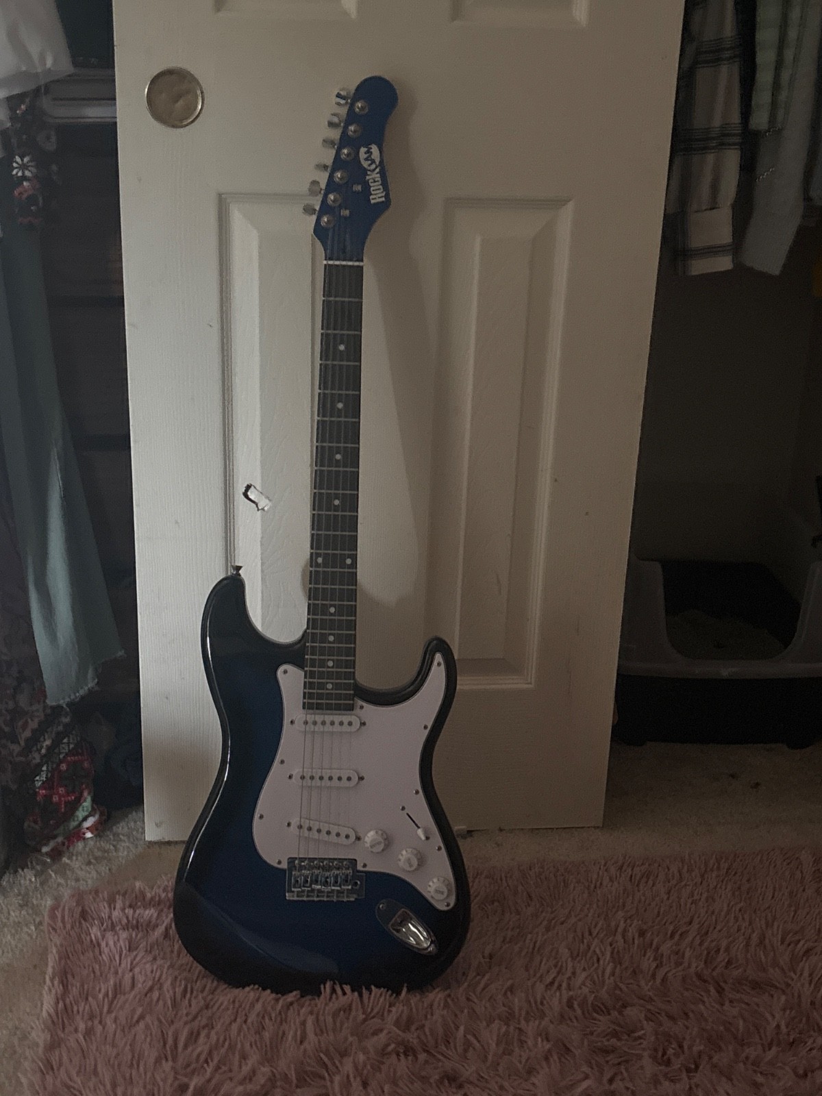 electric guitar, blue and black gradient, strings tuned and in good shape