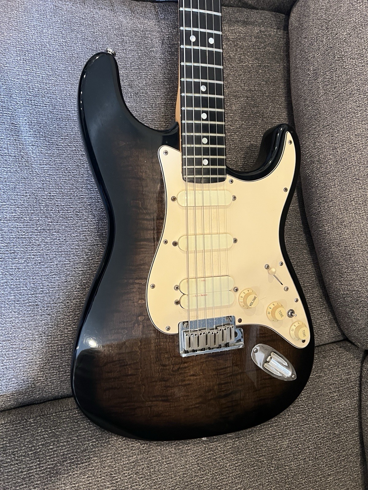 1990 Fender Strat Ultra transparent black over a figured flamed maple top