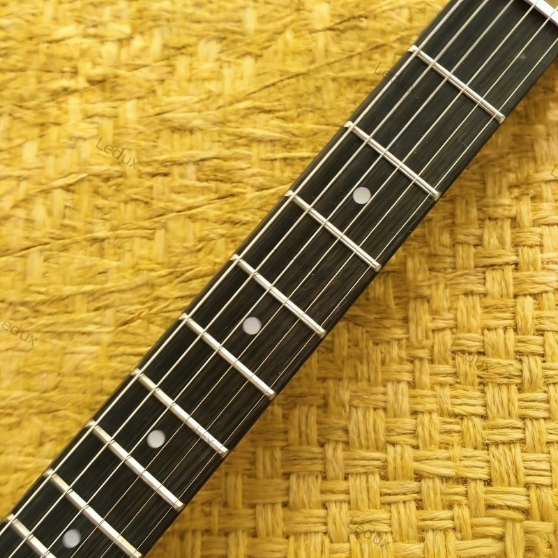 blue quilted electric guitar maple top tremolo bridge rosewood fretboard