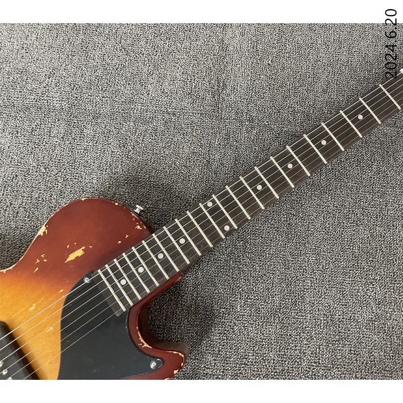 Electric guitar thin brown burst and see wood grain brown back black cover wrap
