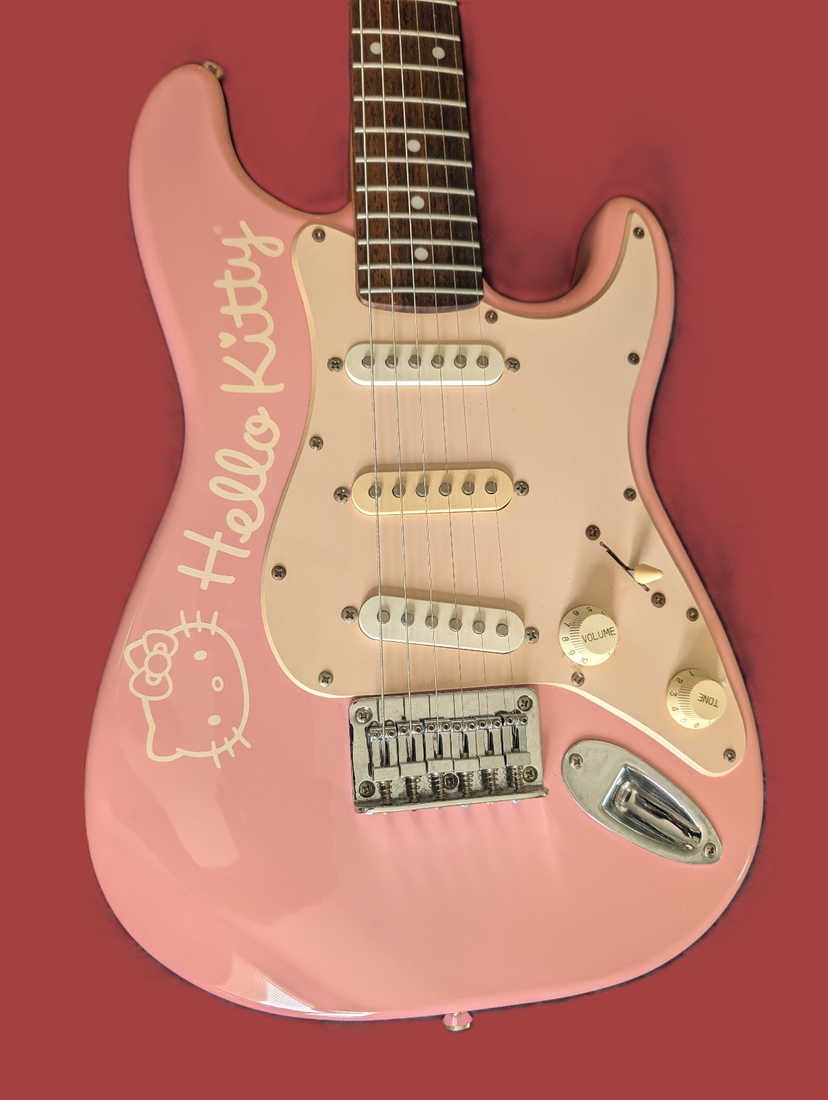 Hello Kitty Pink Squier mini guitar by Fender