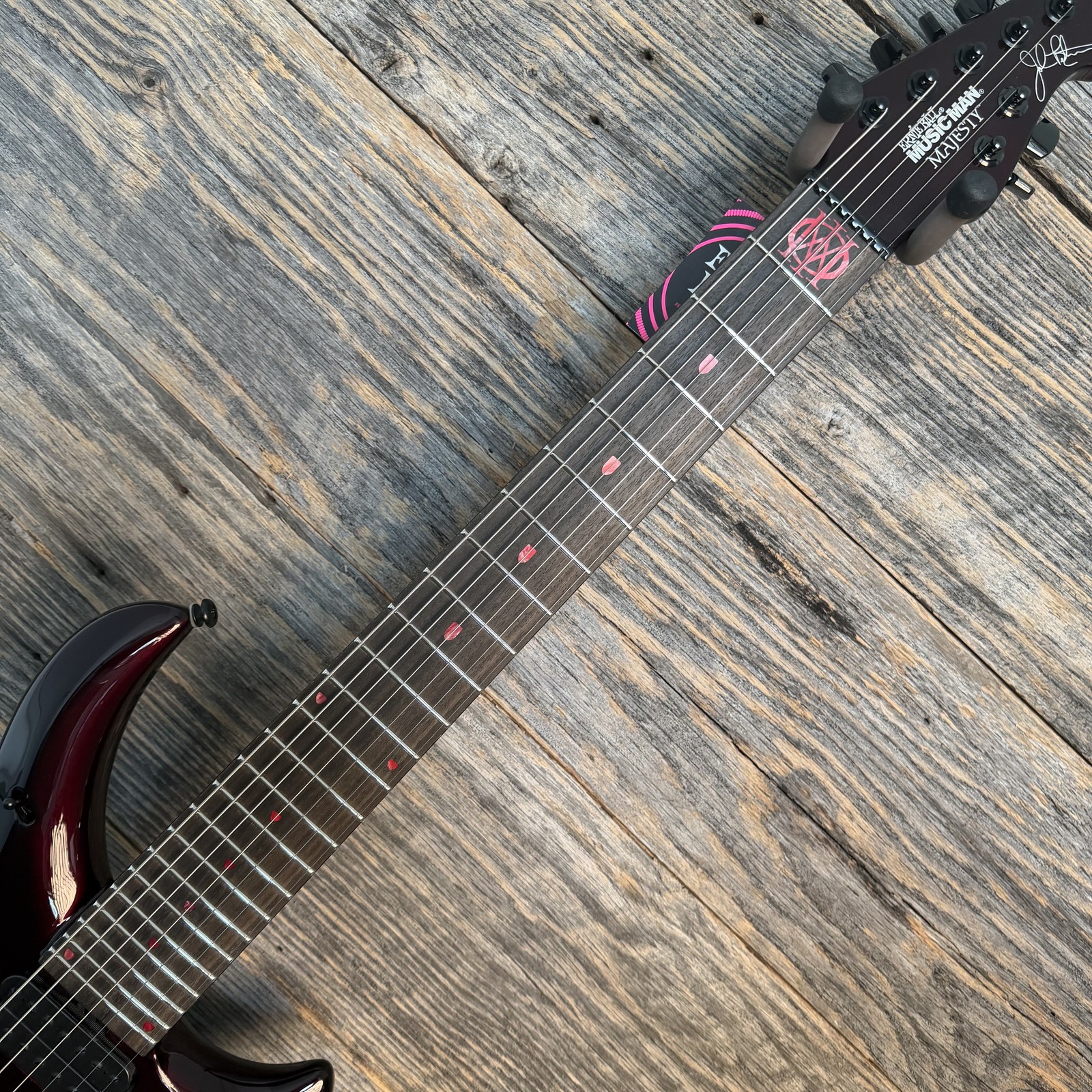Ernie Ball Music Man John Petrucci Majesty Premium Select 7 – Carnelian Red