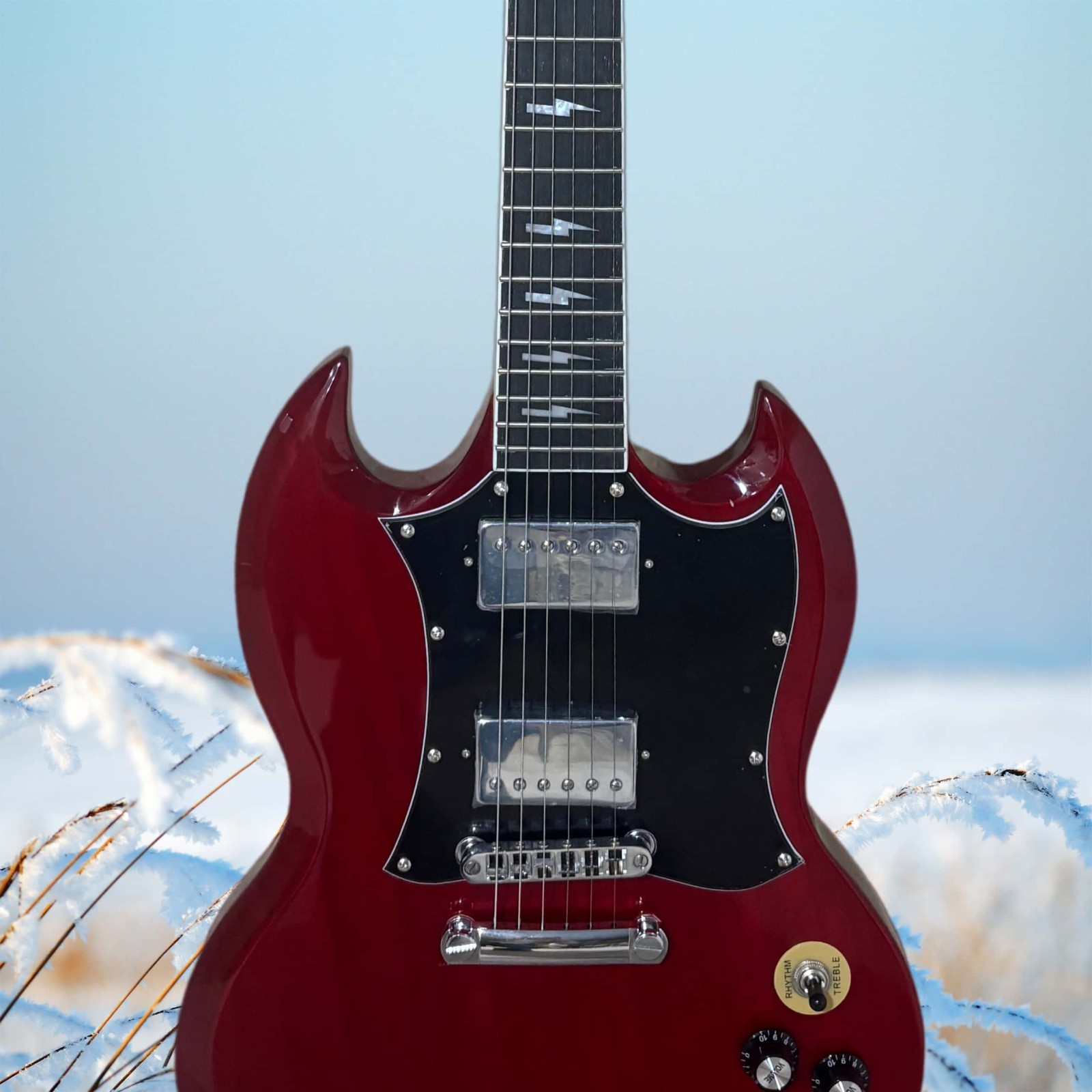 Burgundy electric guitar with a black pickguard and lightning-shaped inlays