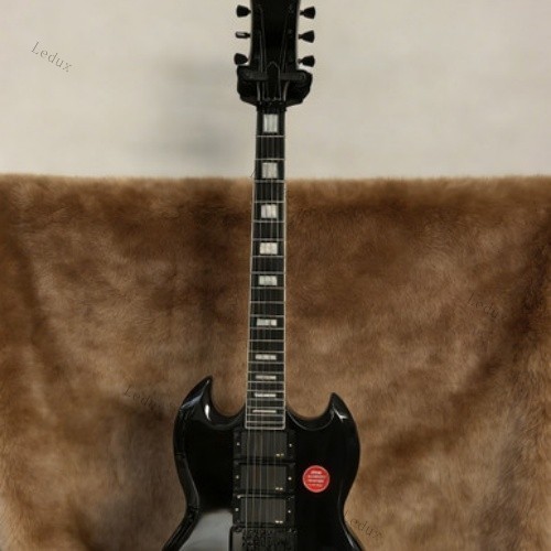electric guitar black tremolo bridge HHH pickups rosewood fretboard lock nut
