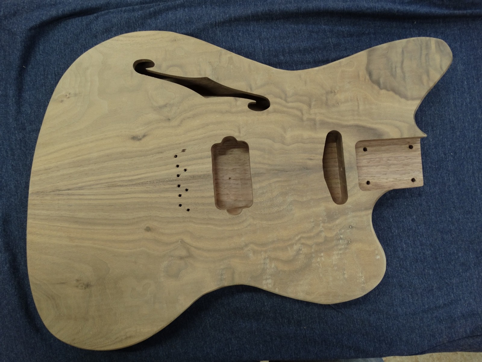 Jaguar style unfinished guitar body- chambered, book matched walnut, S & H p’ups