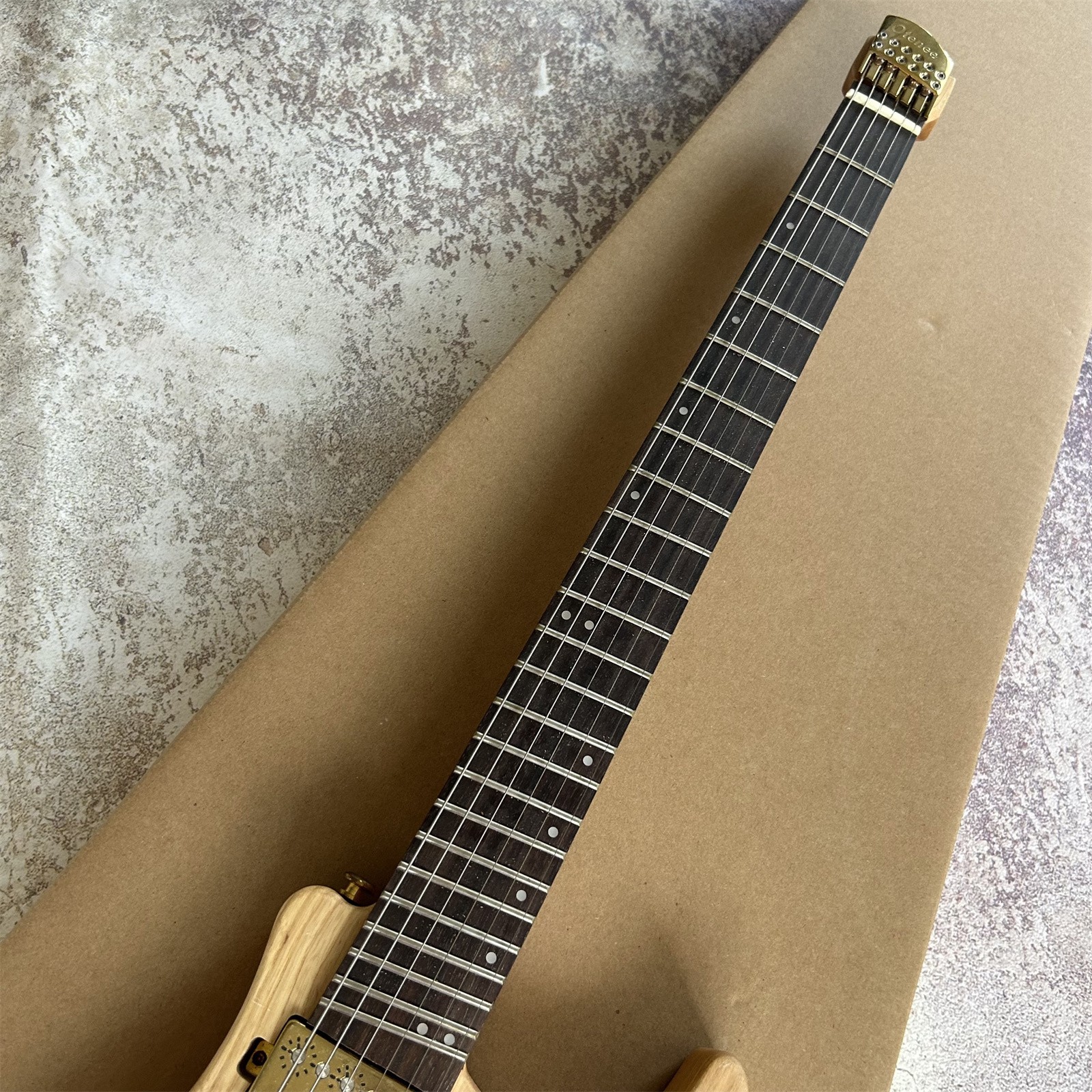 Portable Headless High End Solid Body Log Color Electric Guitar 24 Frets