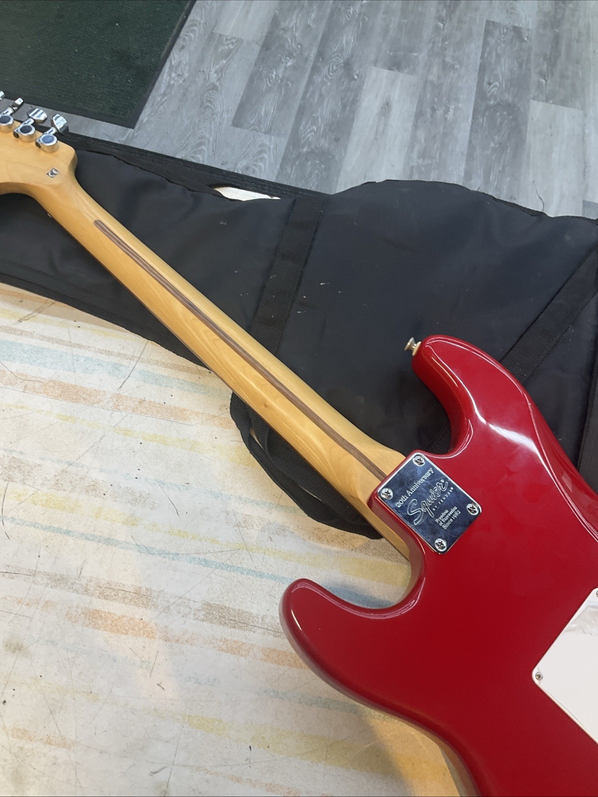 FENDER SQUIER STRAT RED WITH CUSTOM FLORAL 70S DESIGN AND GIG BAG ￼