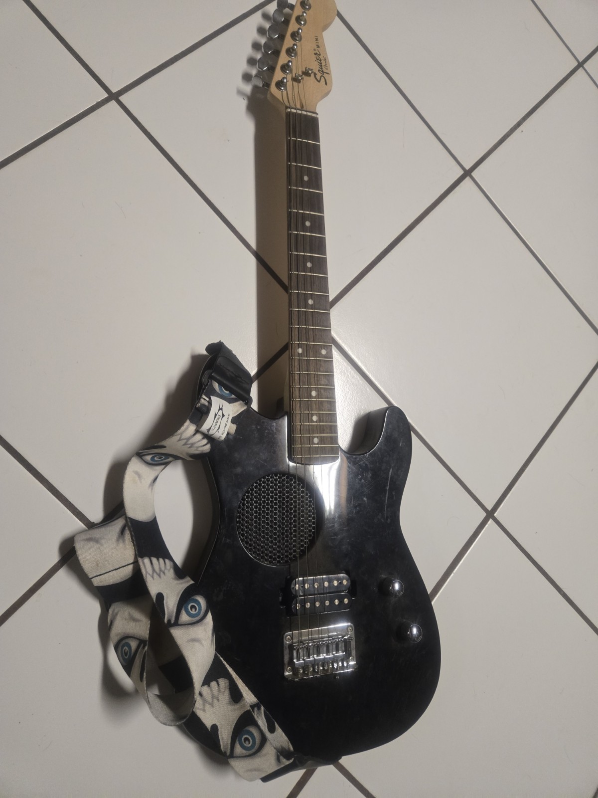 Black Fender Squire Mini With A Perri’s Skull Strap 2007