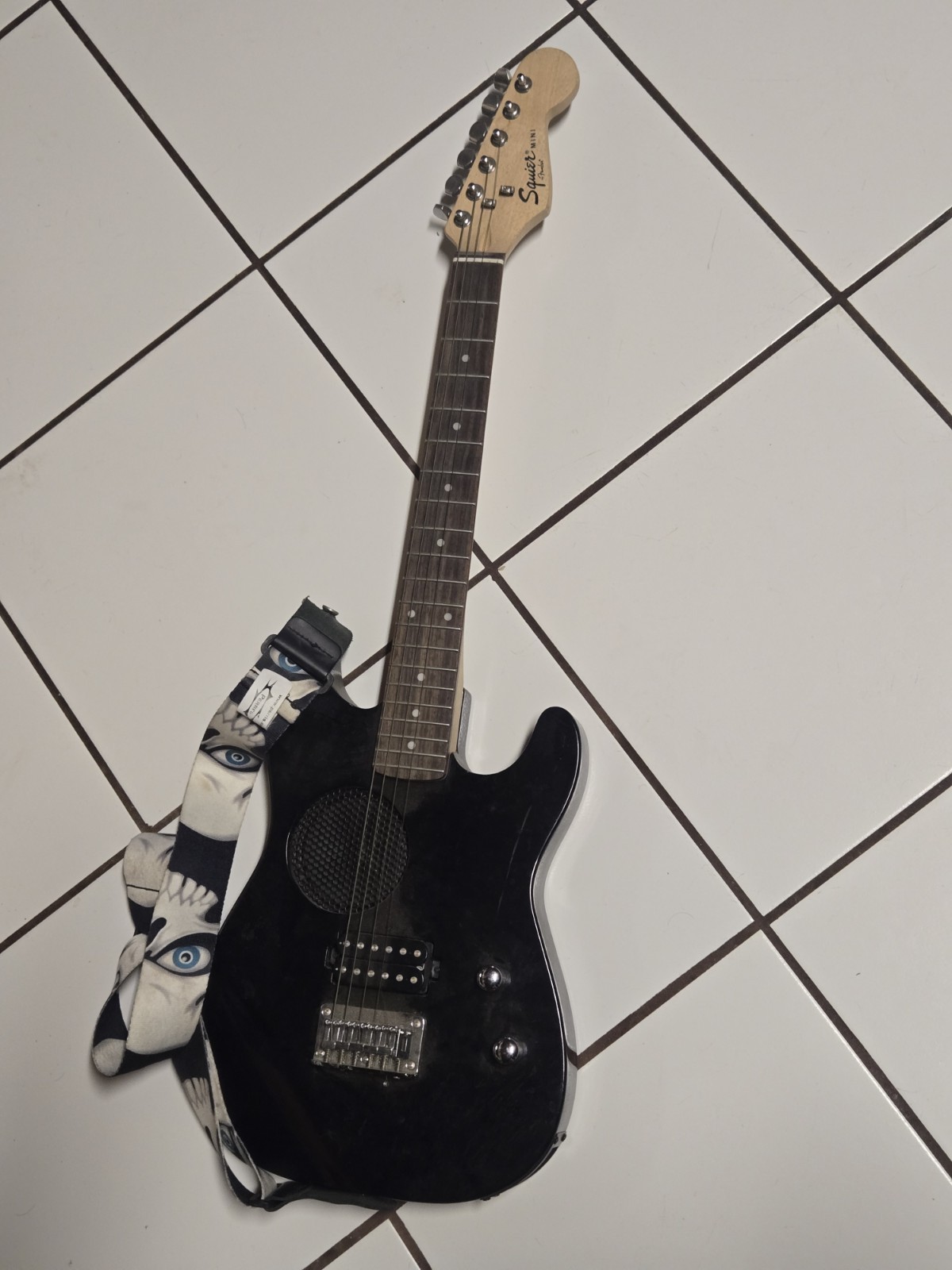 Black Fender Squire Mini With A Perri’s Skull Strap 2007