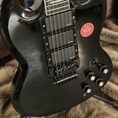 electric guitar black tremolo bridge HHH pickups rosewood fretboard lock nut