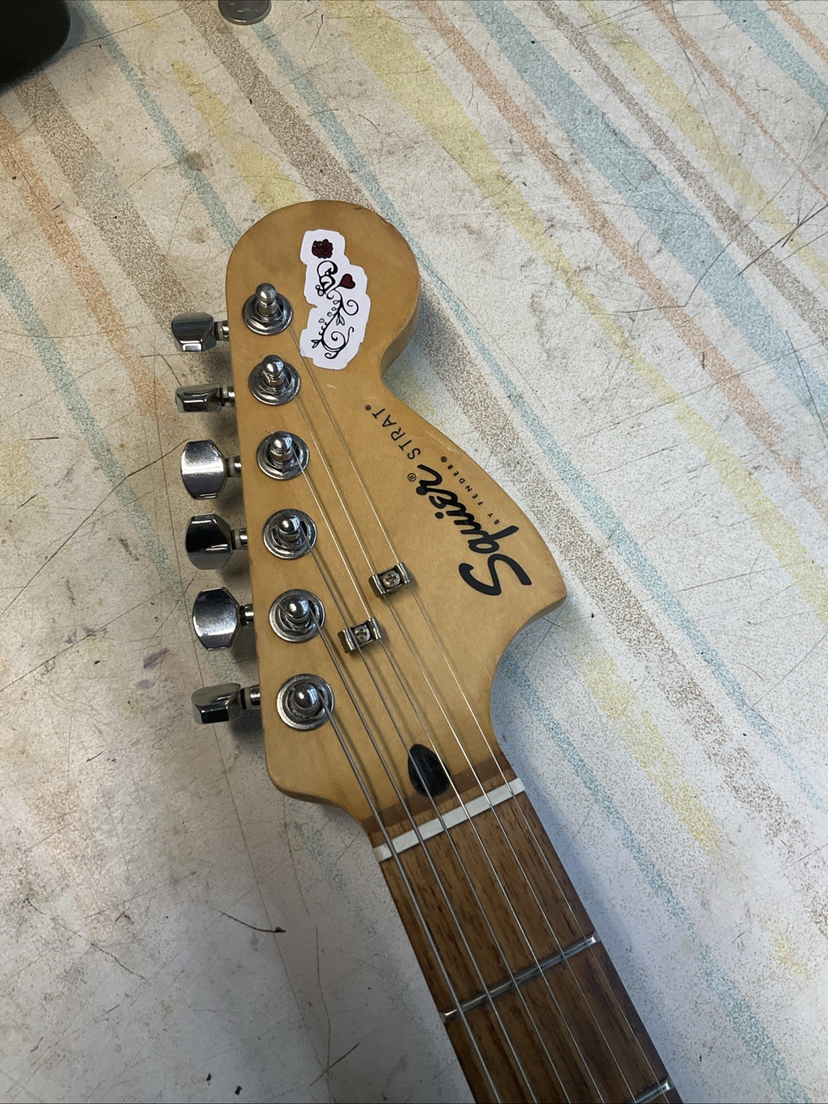 FENDER SQUIER STRAT RED WITH CUSTOM FLORAL 70S DESIGN AND GIG BAG ￼