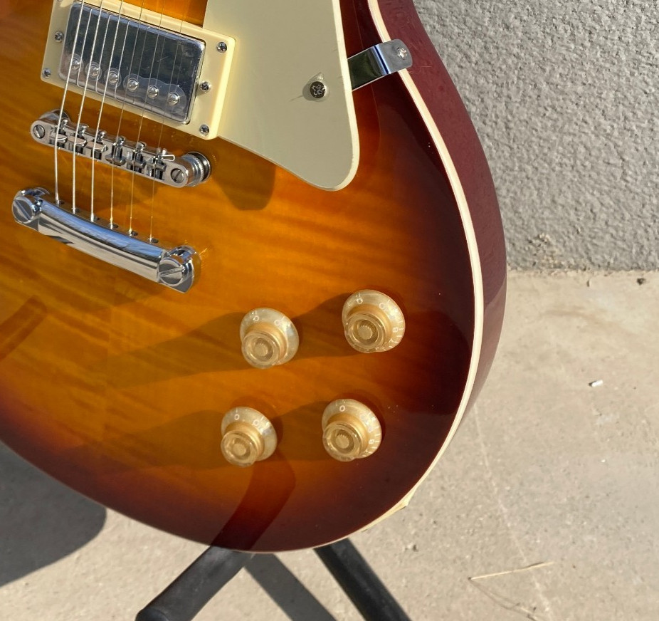 Brown 6-string electric guitar, flame maple top, fast shipping from the US