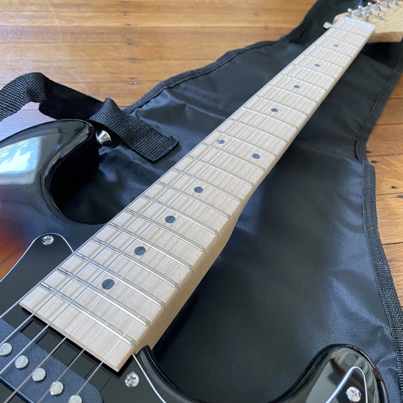 Full-Size Sunburst Electric Guitar Starter Package with 20-watt Amp, and More