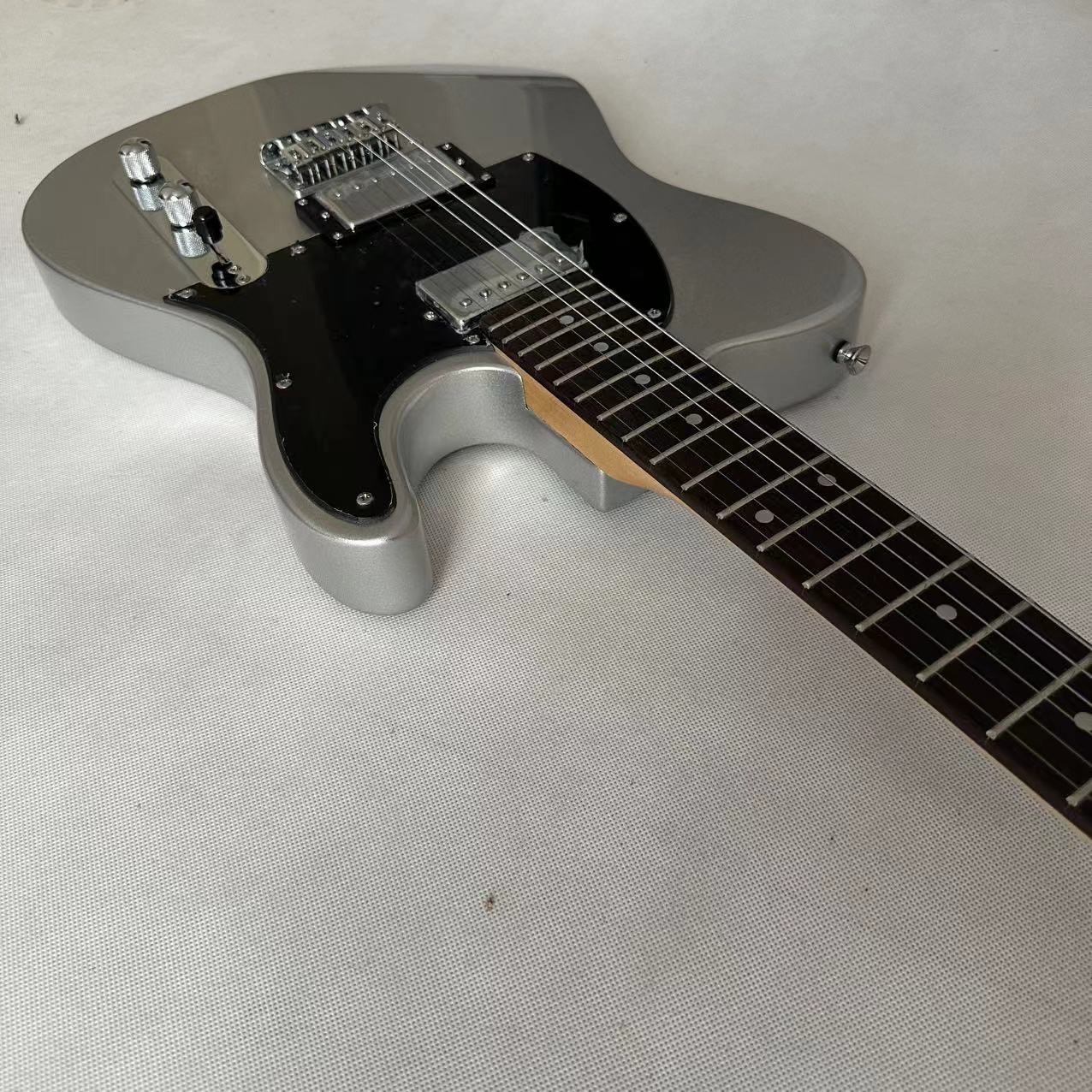 Silver powder white TL electric guitar, fixed bridge black protective plate,