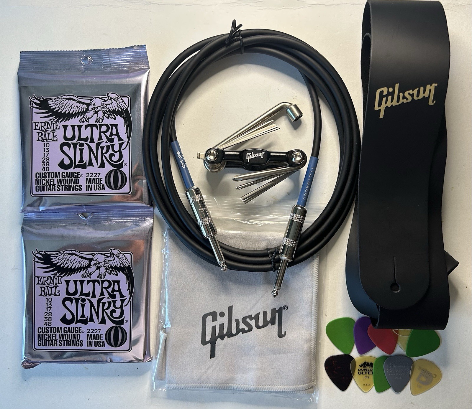 Gibson USA Electric Guitar Accessories LOT- Strap, Multi Tool, Cloth, Strings