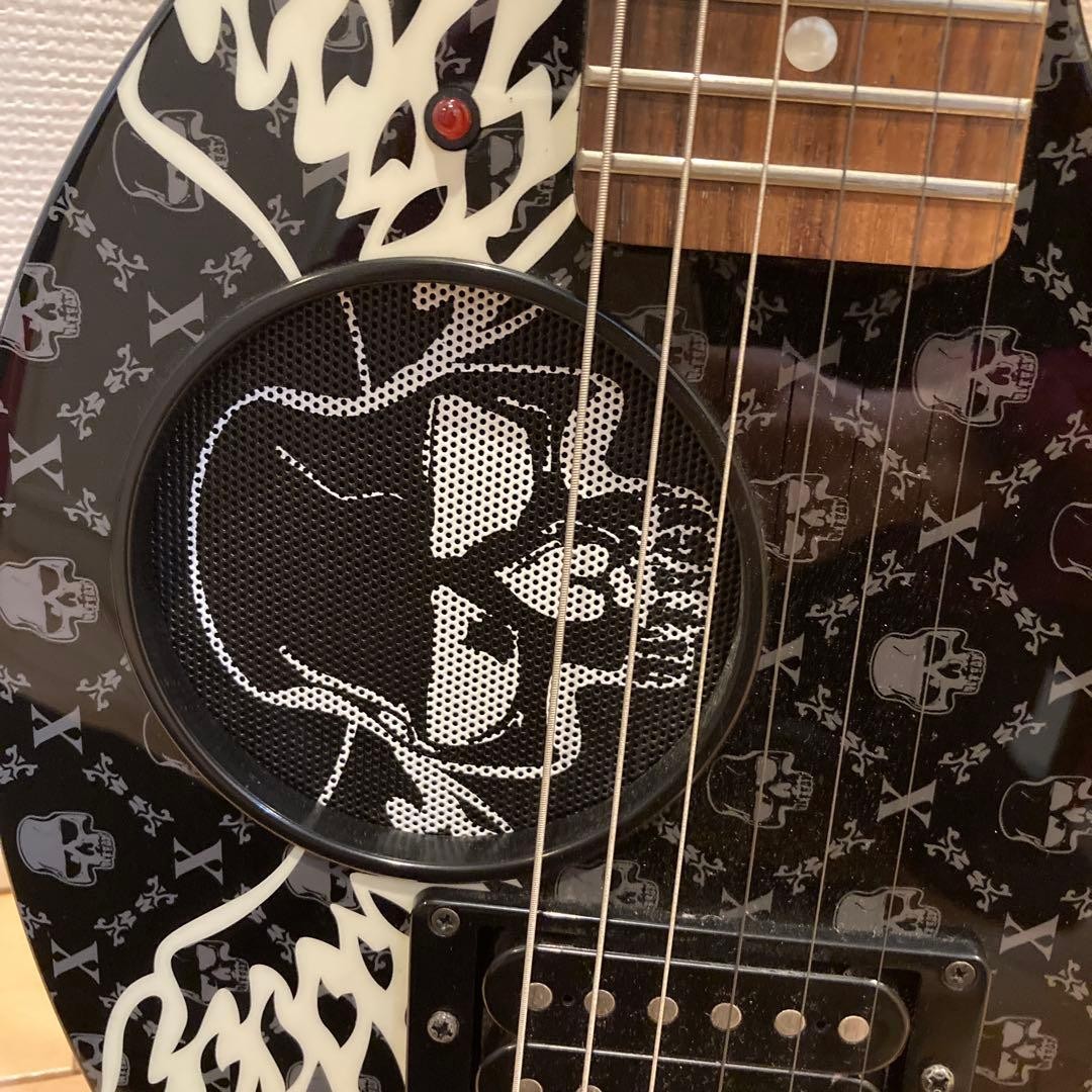 Mint condition FERNANDES electric guitar with skull design, includes original ca
