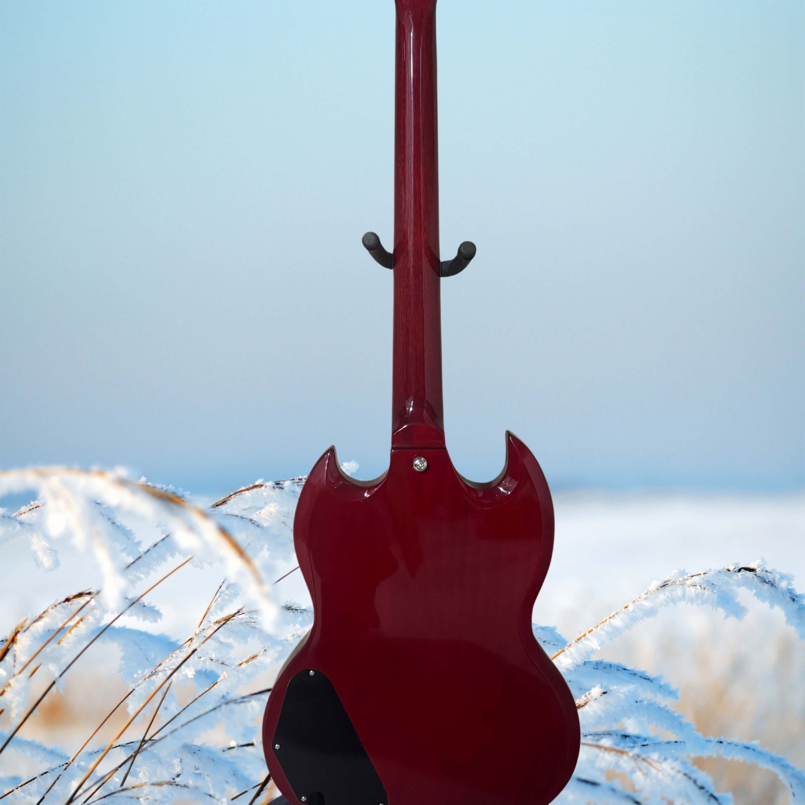 Burgundy electric guitar with a black pickguard and lightning-shaped inlays