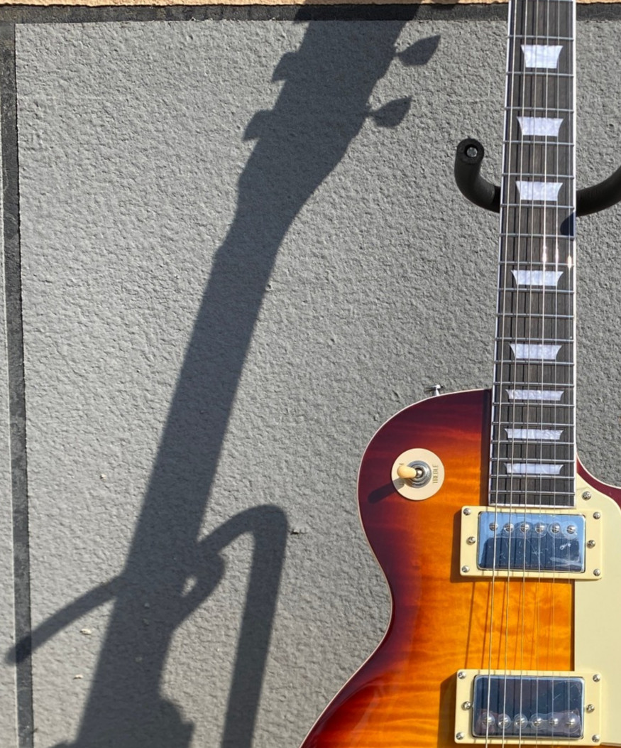 Brown 6-string electric guitar, flame maple top, fast shipping from the US