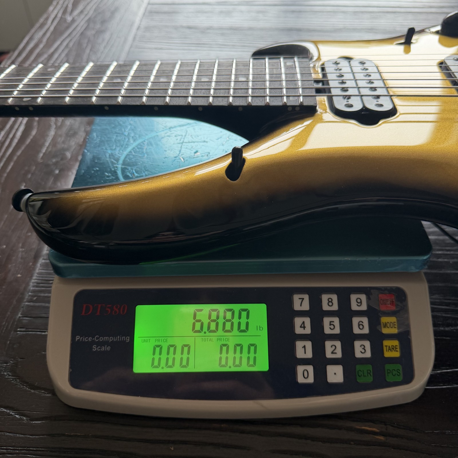 Ernie Ball Music Man Majesty 7 7-String Electric Guitar – Gold Eclipse