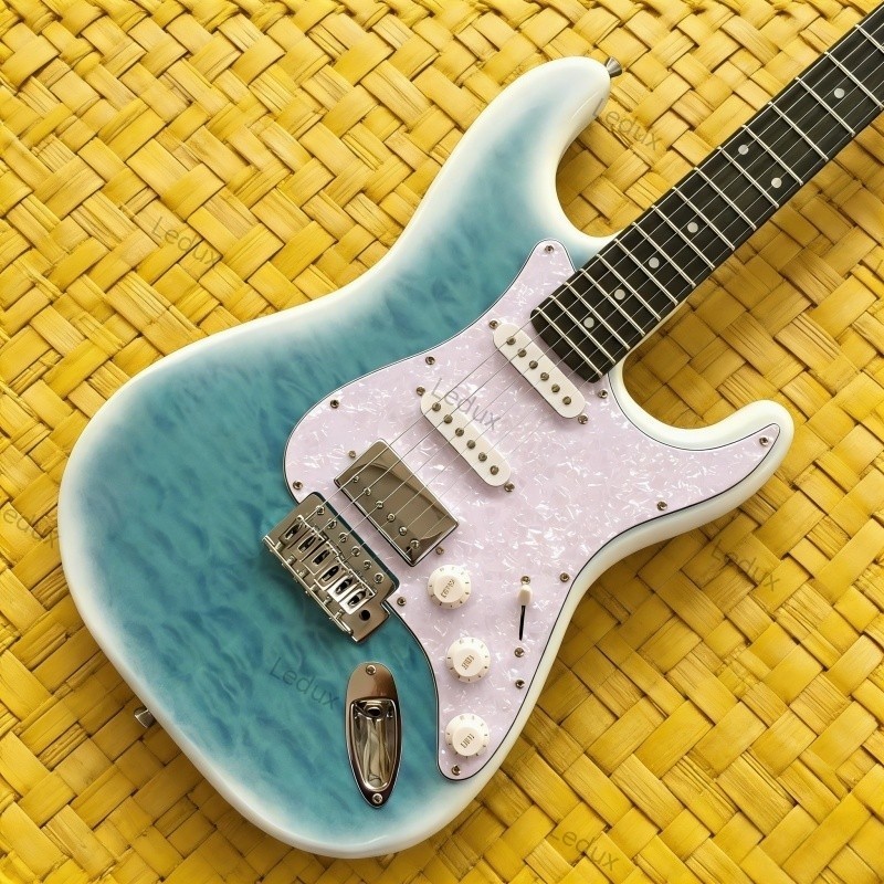blue quilted electric guitar maple top tremolo bridge rosewood fretboard