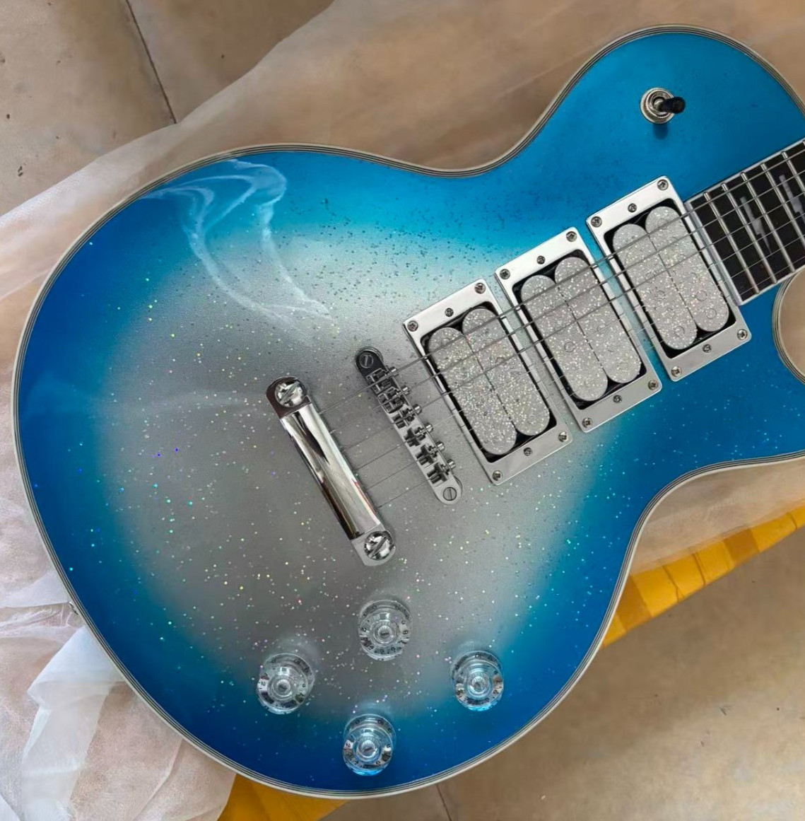 Customized blue lightning guitar with rosewood paperboard. Free shipping.