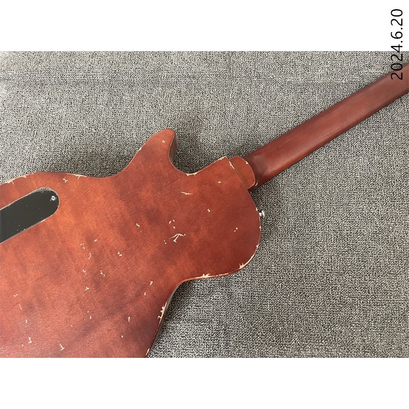 Electric guitar thin brown burst and see wood grain brown back black cover wrap